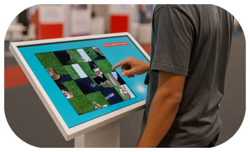 Guest solving a scrambled photo puzzle on a touchscreen at an event. Interactive image puzzle game rental for exhibitions, corporate events, and activations in Dubai.